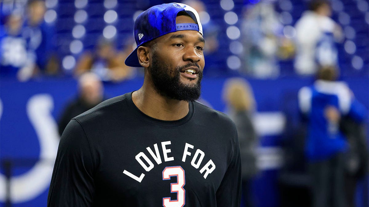 Shaquille Leonard stands on the field