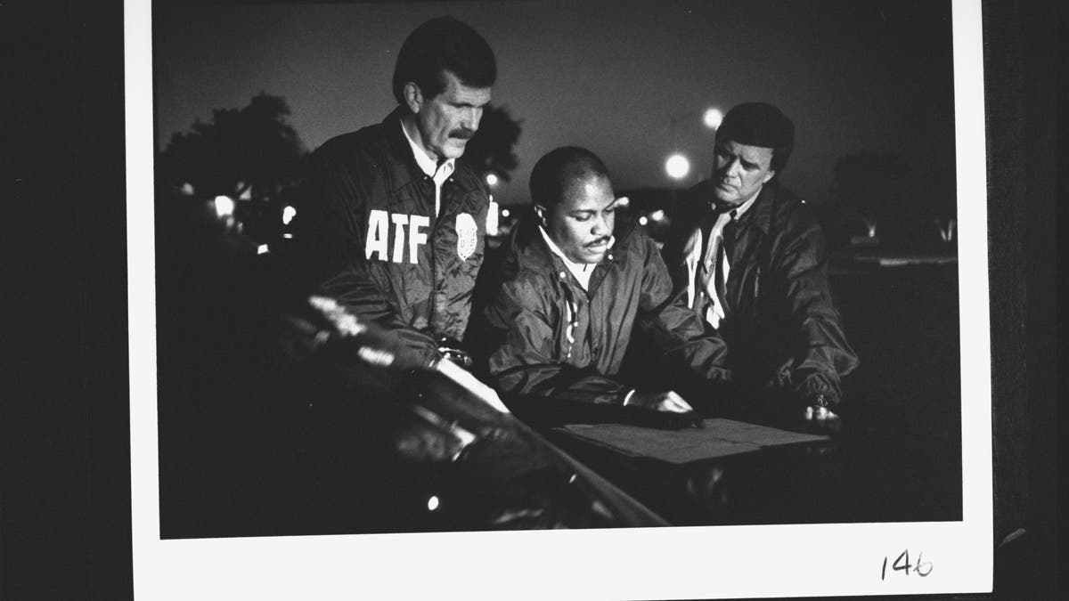 Fire agent Chuck Meyer with homicide Sergeants John Jones and Mike Huckaby