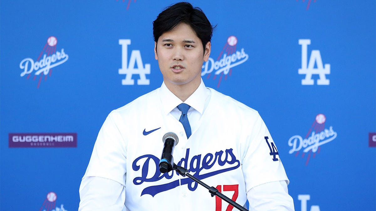 Shohei Ohtani speaks to the media