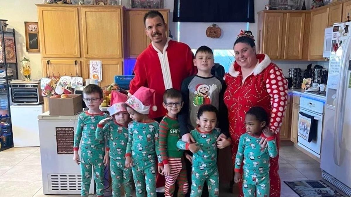 A family picture including slain Jerry Lopez with his wife and children