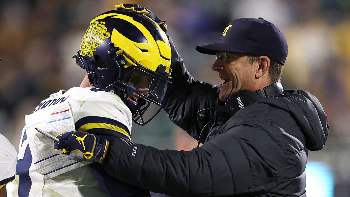 Jim Harbaugh and JJ McCarthy