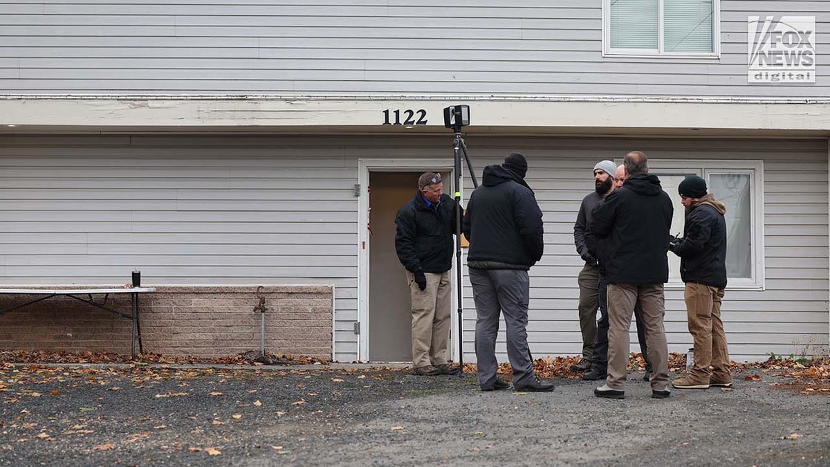 Investigators set up outside the home where four University of Idaho students were slain in November last year