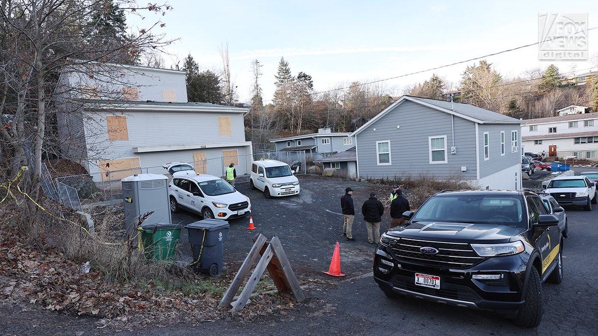 Utility workers inspect the house where four University of Idaho students were fatally stabbed in Moscow, Idaho