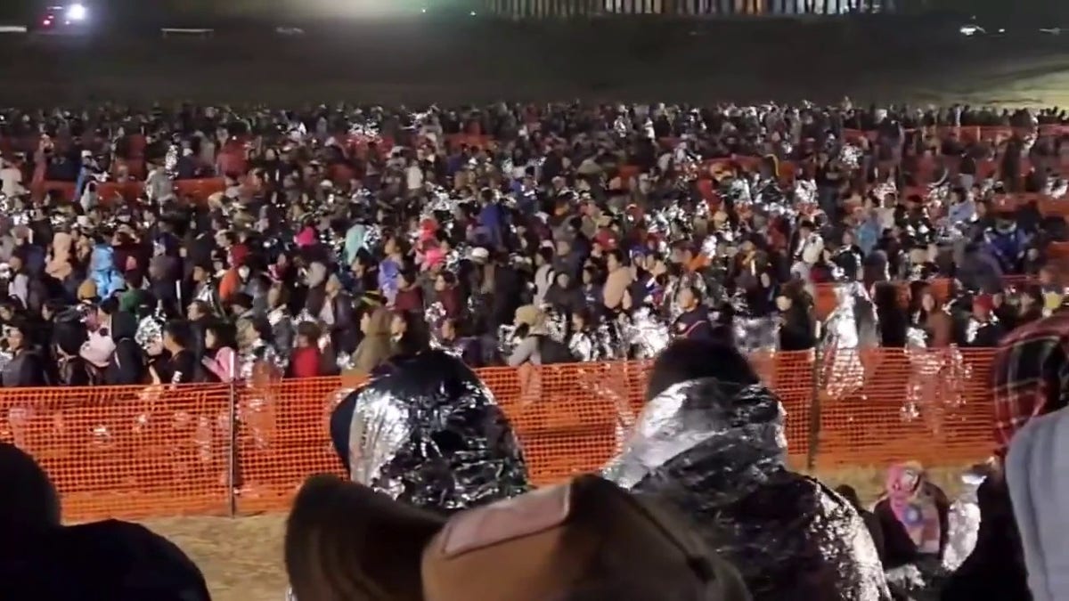 Migrants waiting to be processed by Border Patrol