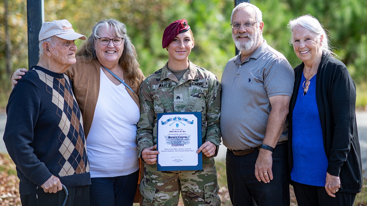 Sgt. Hay posing for photo with family