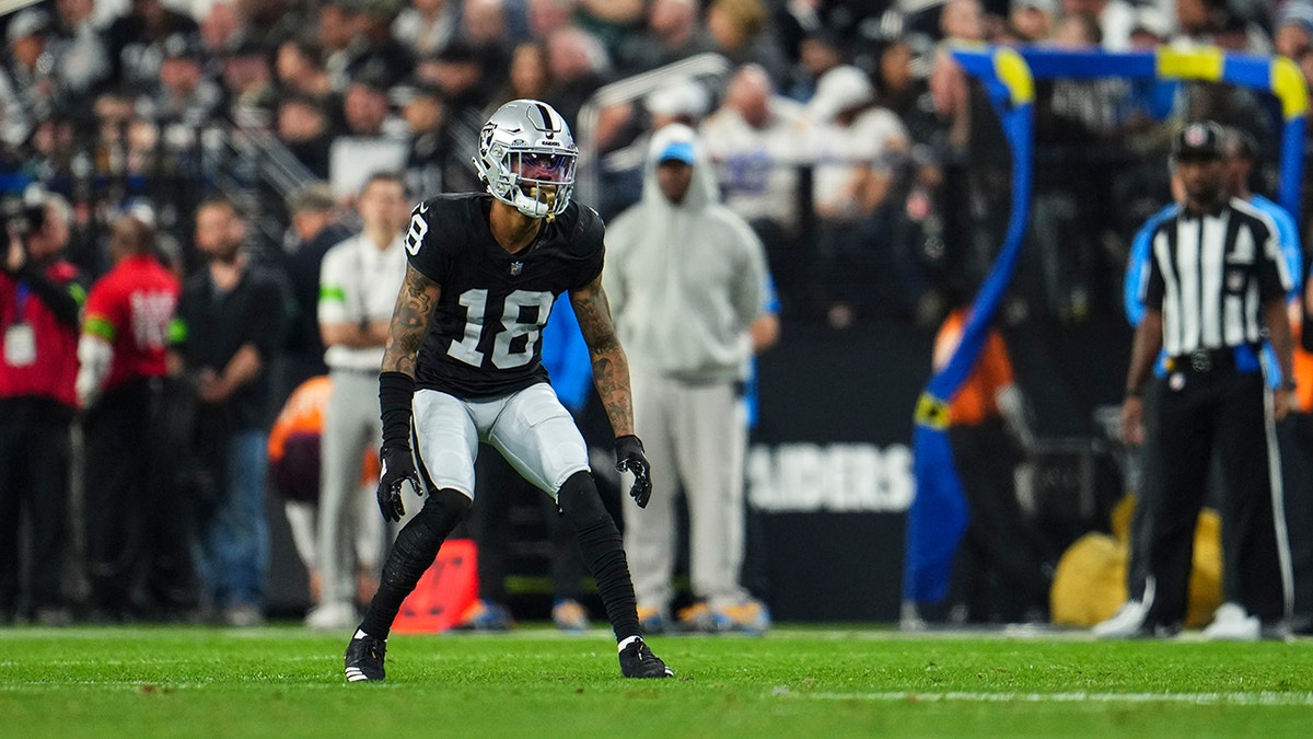 Jack Jones defends a pass during an NFL game