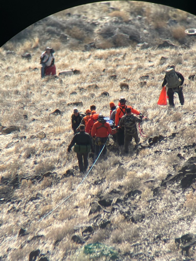 Rescuers moving Penny Clark from the ravine.