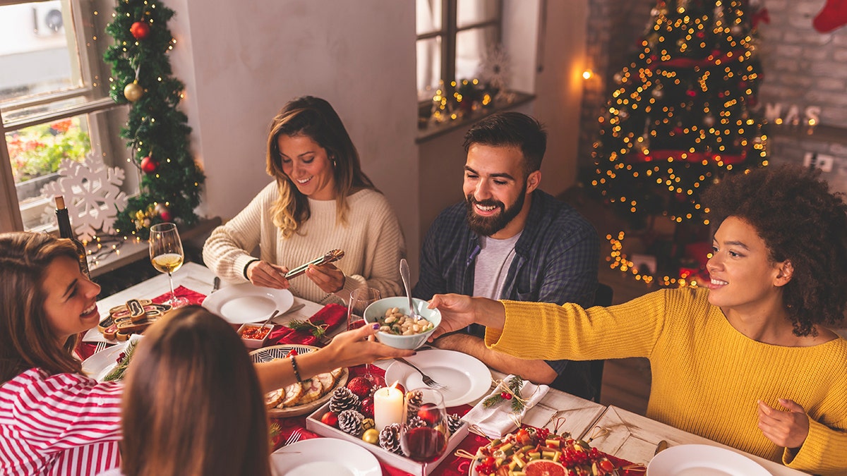 Friends celebrating around the Christmas table