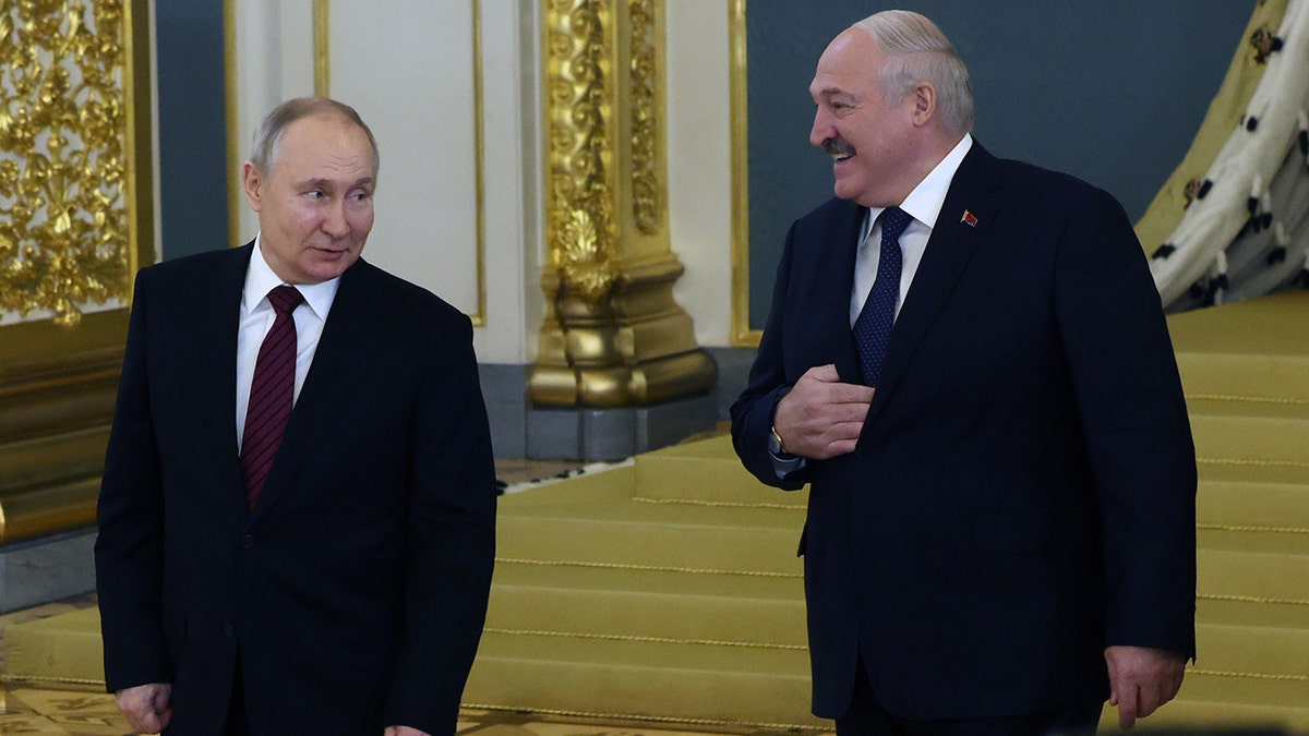 Russian President Vladimir Putin speaks with Belarusian President Alexander Lukashenko