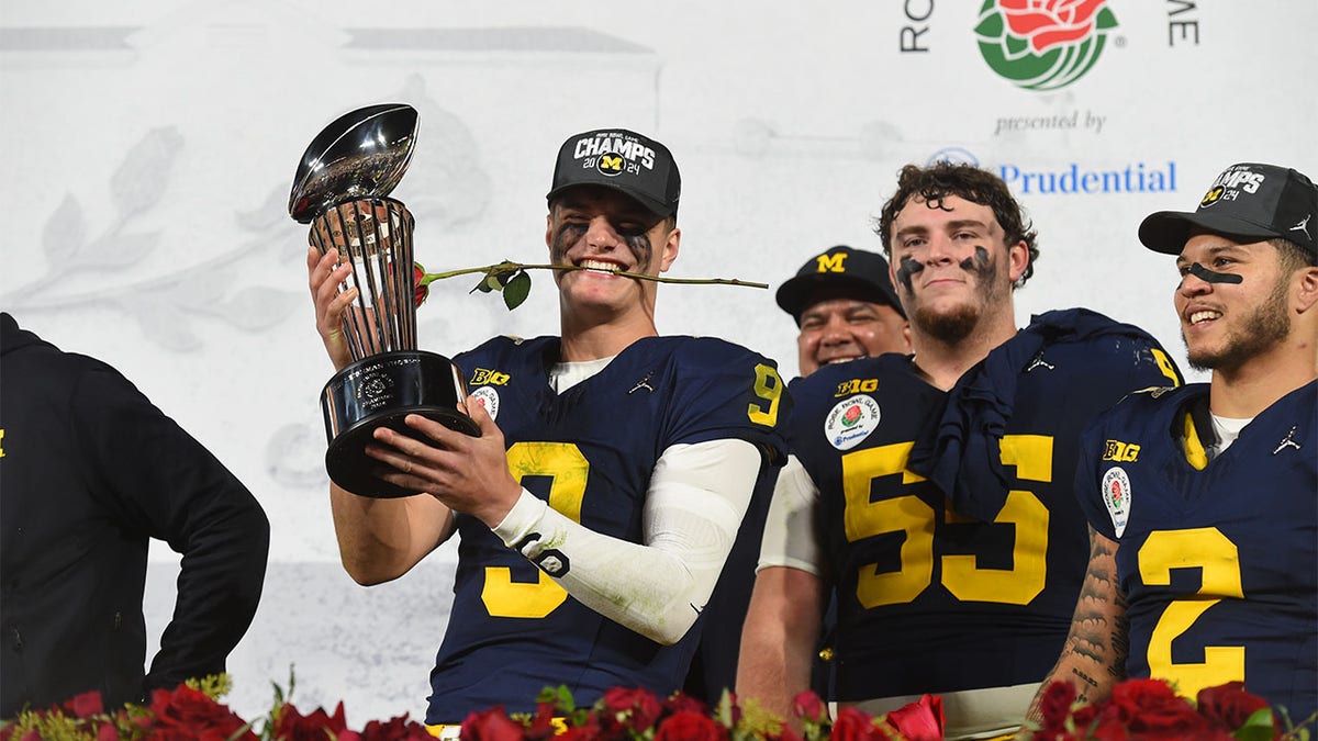 QB J.J. McCarthy celebrates winning the Rose Bowl