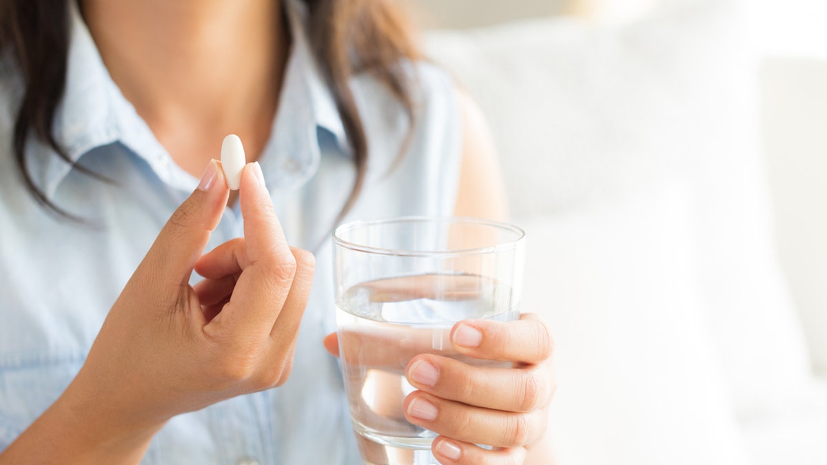 Woman taking medication