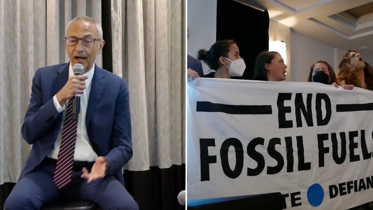 Activists interrupt a talk given by White House senior adviser John Podesta on Wednesday morning.