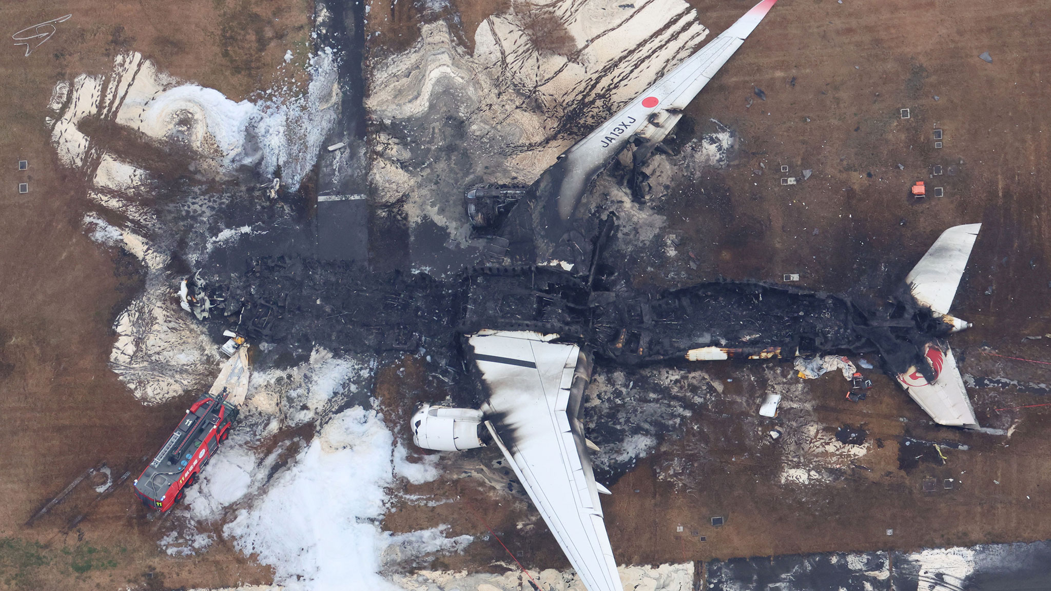 An aerial video shows the burnt Japan Airlines' Airbus A350 plane at Haneda International Airport