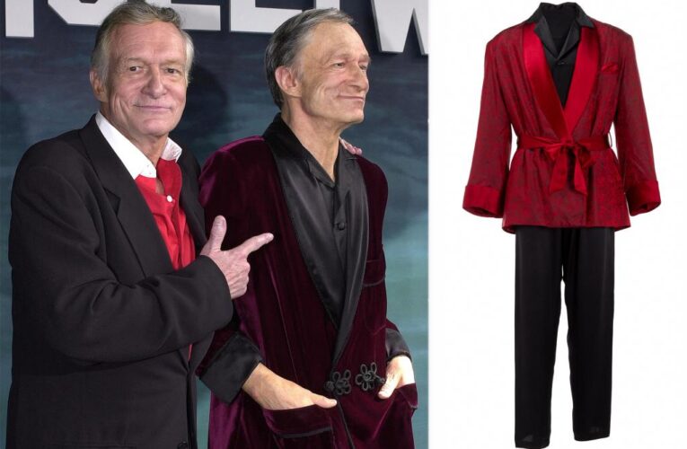 Hugh Hefner’s iconic red velvet smoking jacket up for auction, expected to sell for $3K