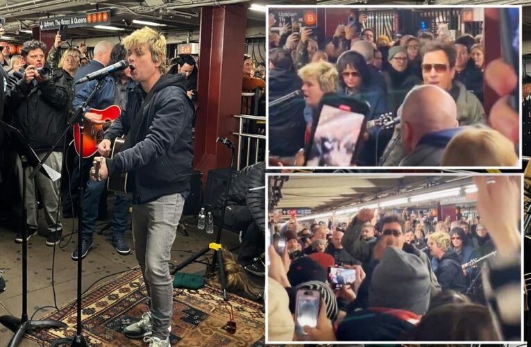 Green Day performs surprise acoustic set in NYC subway
