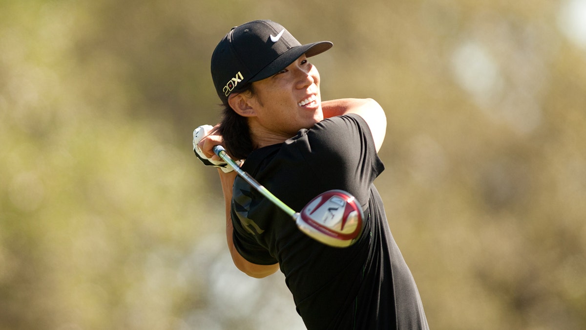 Anthony Kim finishes swing