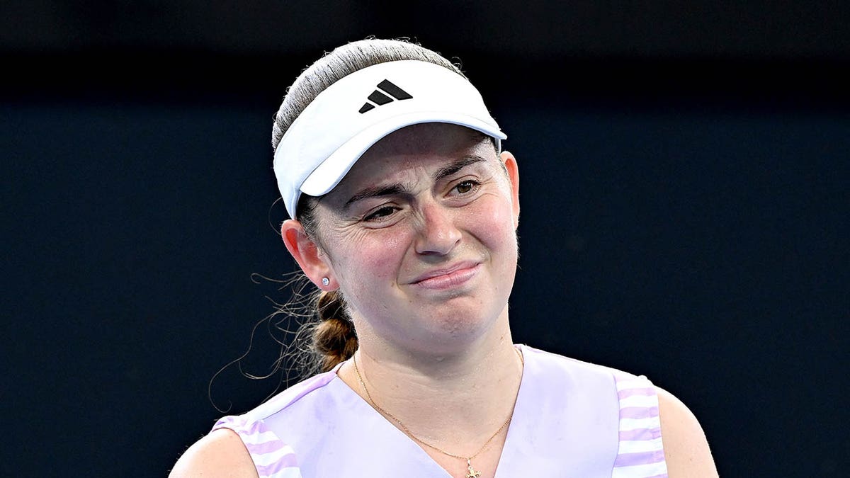 Jelena Ostapenko looks frustrated during a tennis match