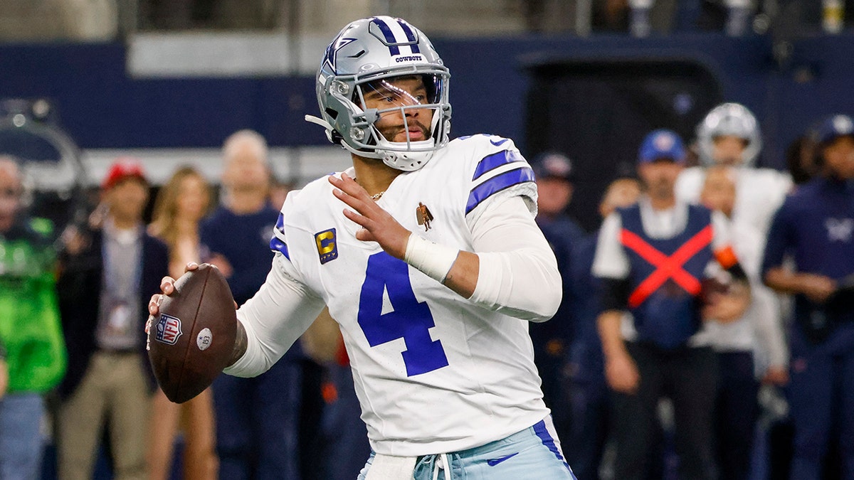 Dak Prescott looks to pass