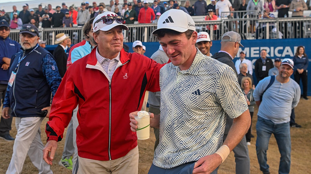 Jay Seawell congratulates Nick Dunlap