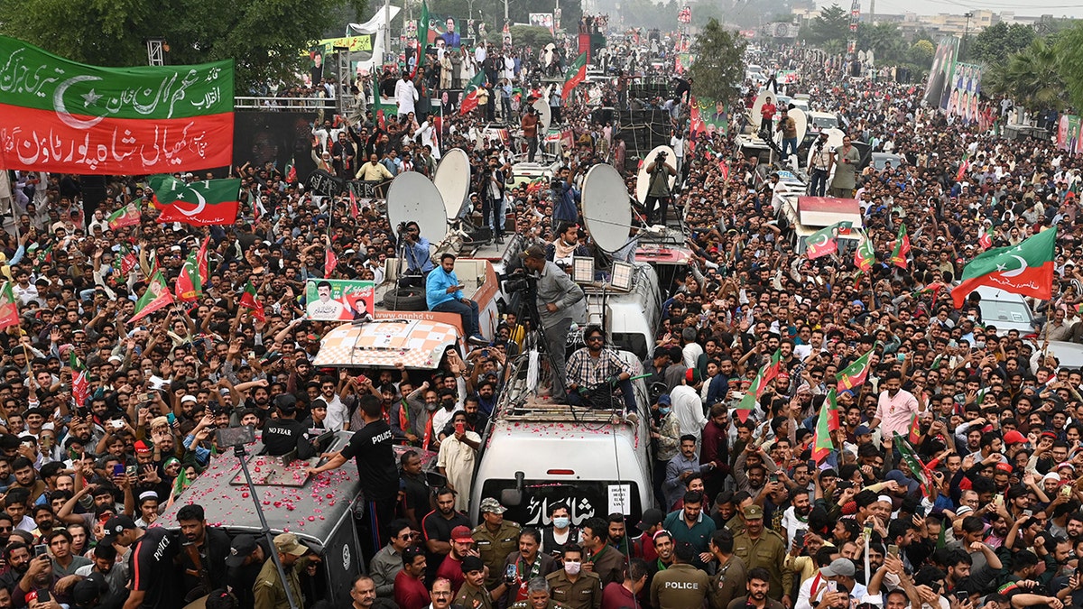 Hundreds of Khan's supporters marching