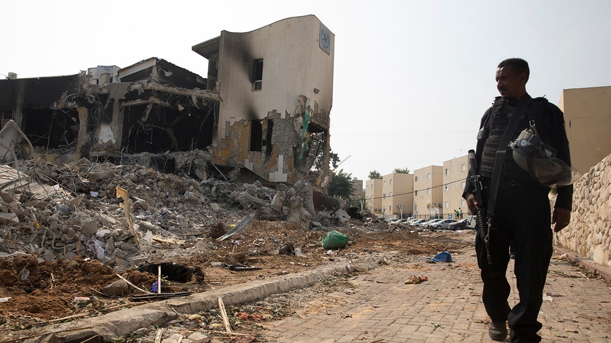 Destroyed building, soldier