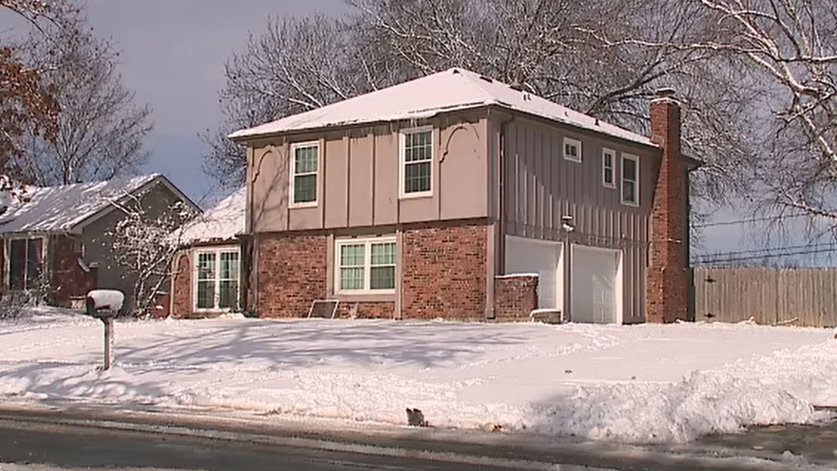 Home with snow on roof and ground