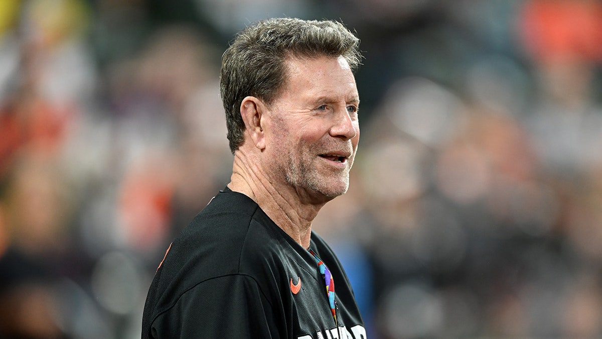 Jim Palmer looks on field