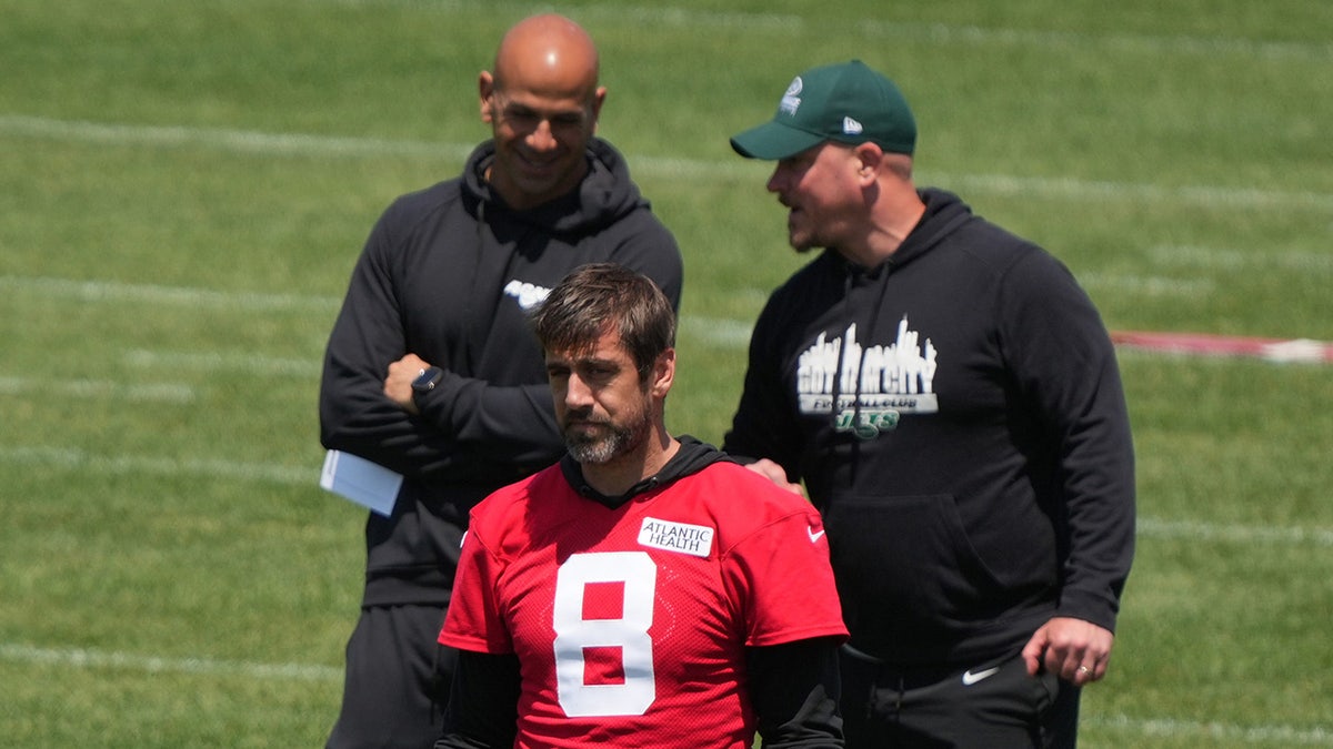 Jets coaches and Aaron Rodgers seen during a practice