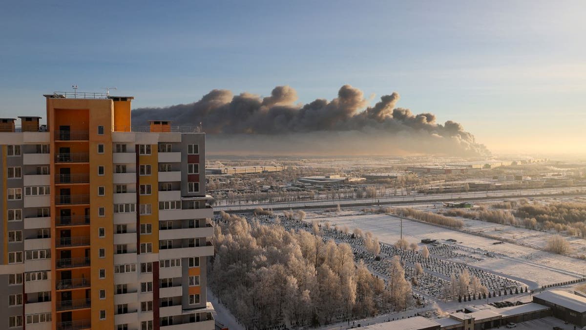 Heavy smoke rises above a burning warehouse in Russia