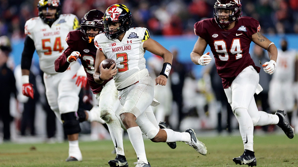 aryland quarterback Taulia Tagovailoa runs