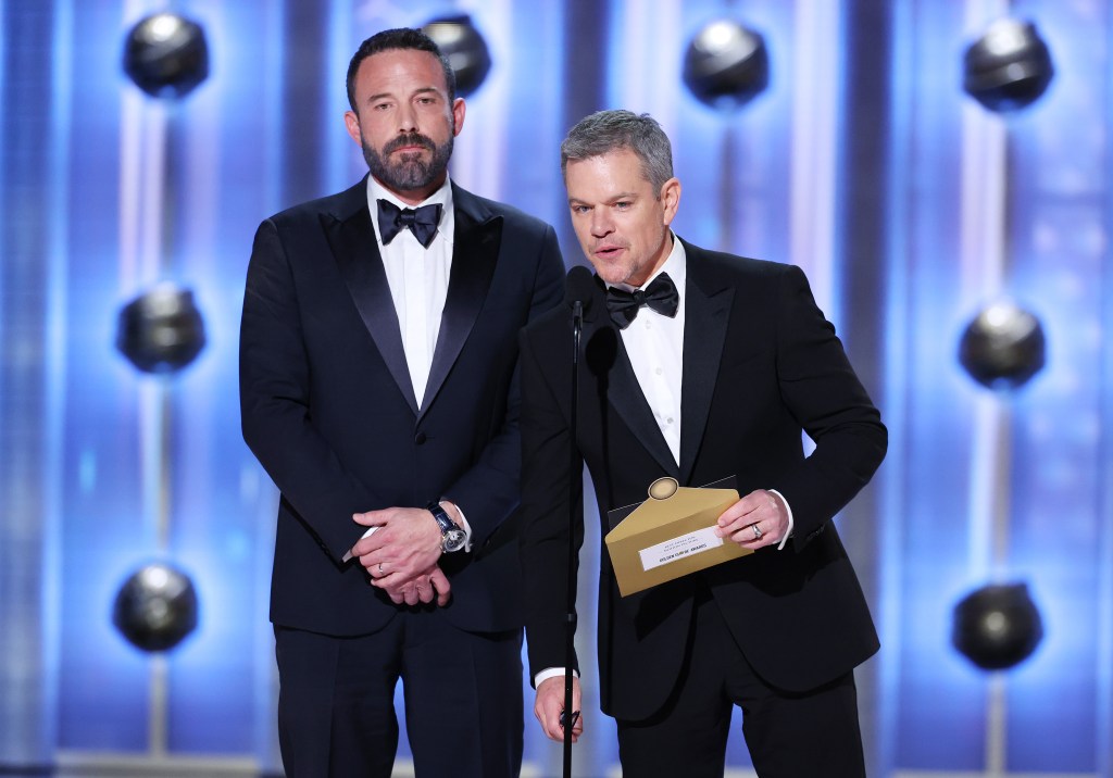 Ben Afflect and Matt Damon presenting the Best Director Award during Sunday's Golden Globes telecast on CBS. Christopher Nolan ("Oppenheimer") won.