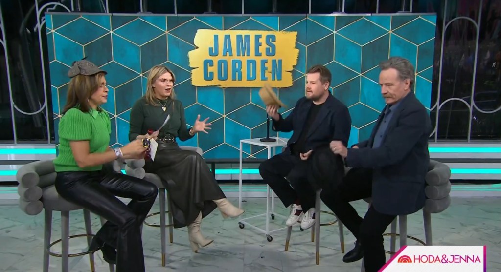 Bryan Cranston, James Corden, and Jenna Bush Hager sitting in chairs, recalling their first encounter at a restaurant on "Today with Hoda & Jenna.