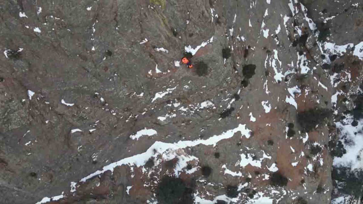 hiker on rocky ledge