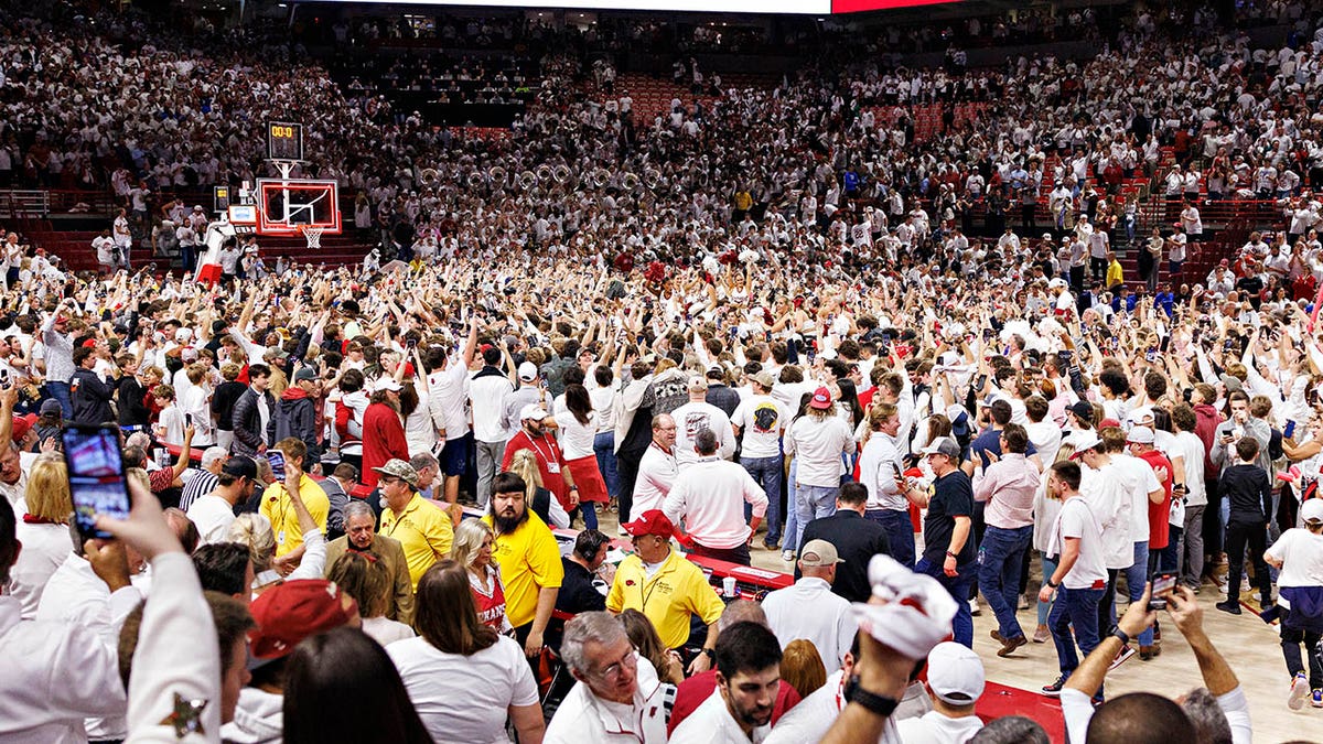 Arkansas fans storm court