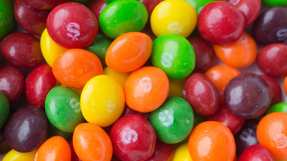 This Wednesday, June 1, 2016, photo shows Skittles, in New York. The Associated Press takes a look at how candy, cookie and soda makers are shaping nutrition science. Critics say industry-funded research is marketing masquerading as science, but the findings nevertheless become a part of the scientific literature. (AP Photo/Mark Lennihan)