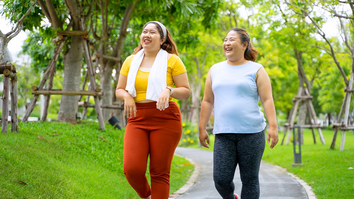 two women workout outside