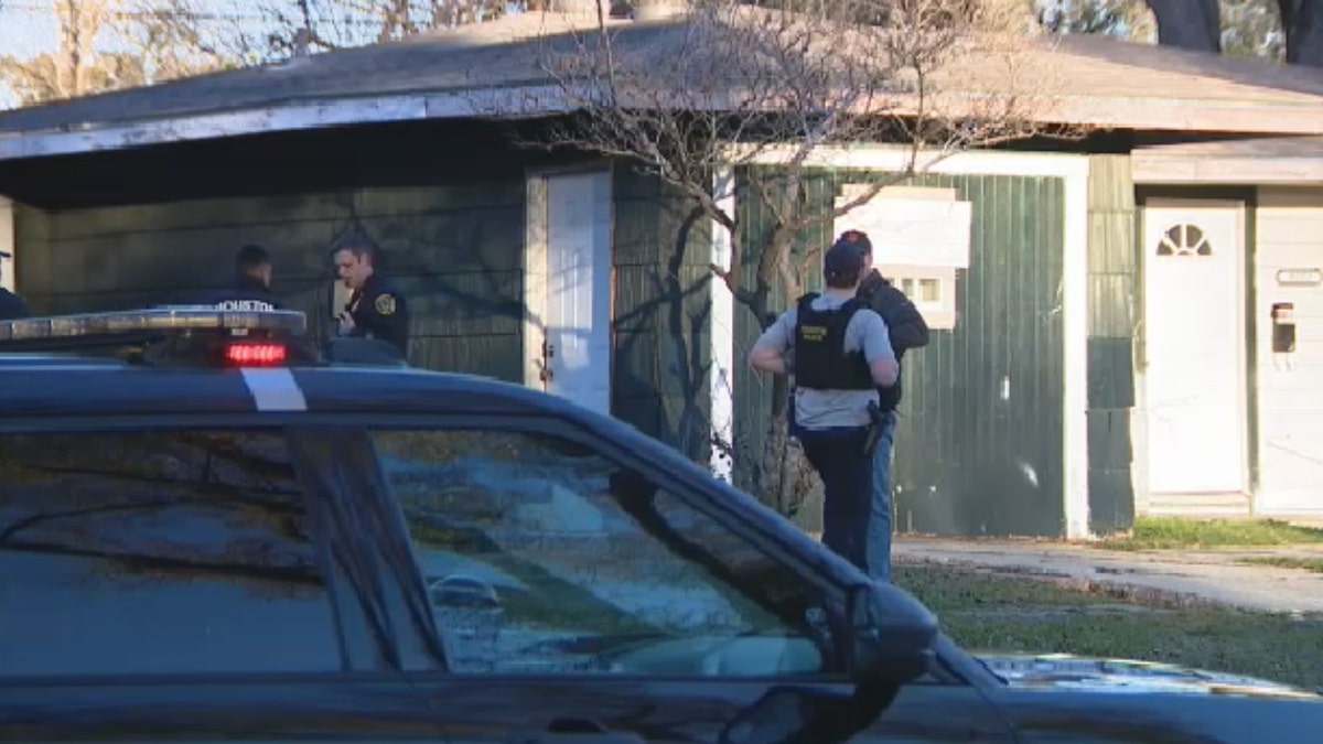 Houston police at Lee Carter's residence on Friday