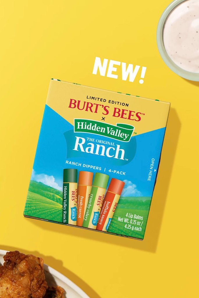 Pack of Burt's Bees x Hidden Valley Ranch lip balm set with wings and ranch in the background.