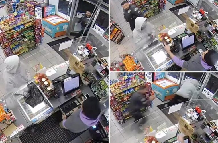 Video shows cop walking in on armed robbery at 7-Eleven