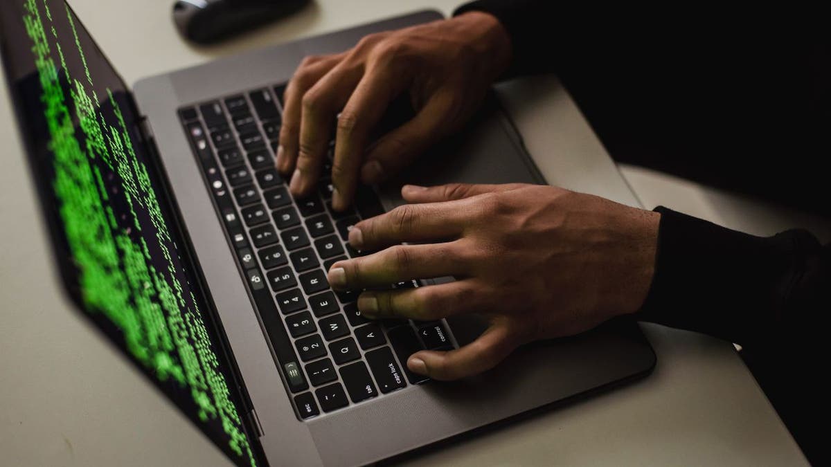 Man typing on the computer.