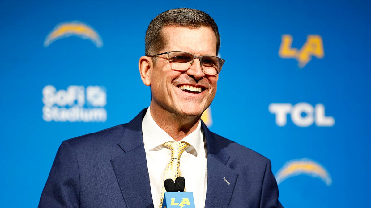 Jim Harbaugh holds a press conference