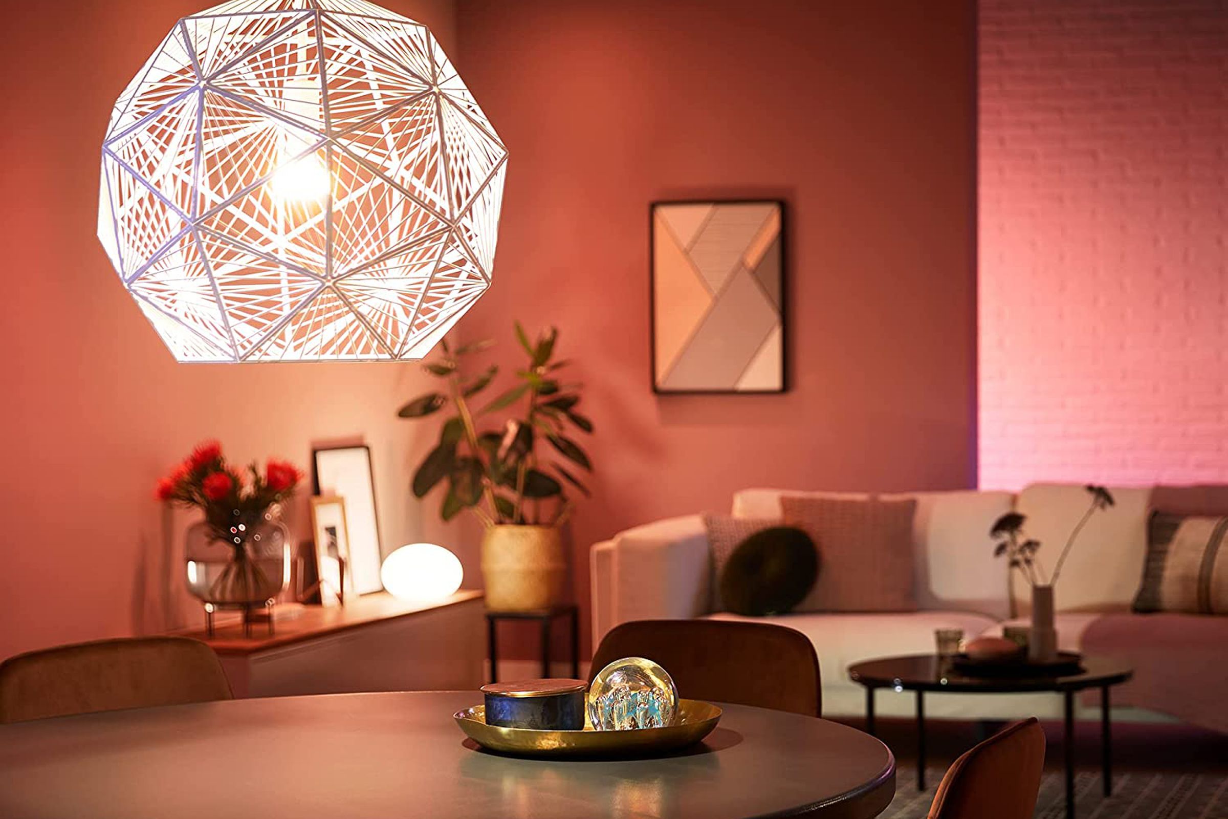 Philips Hue’s A19 smart bulb lighting up a living room.