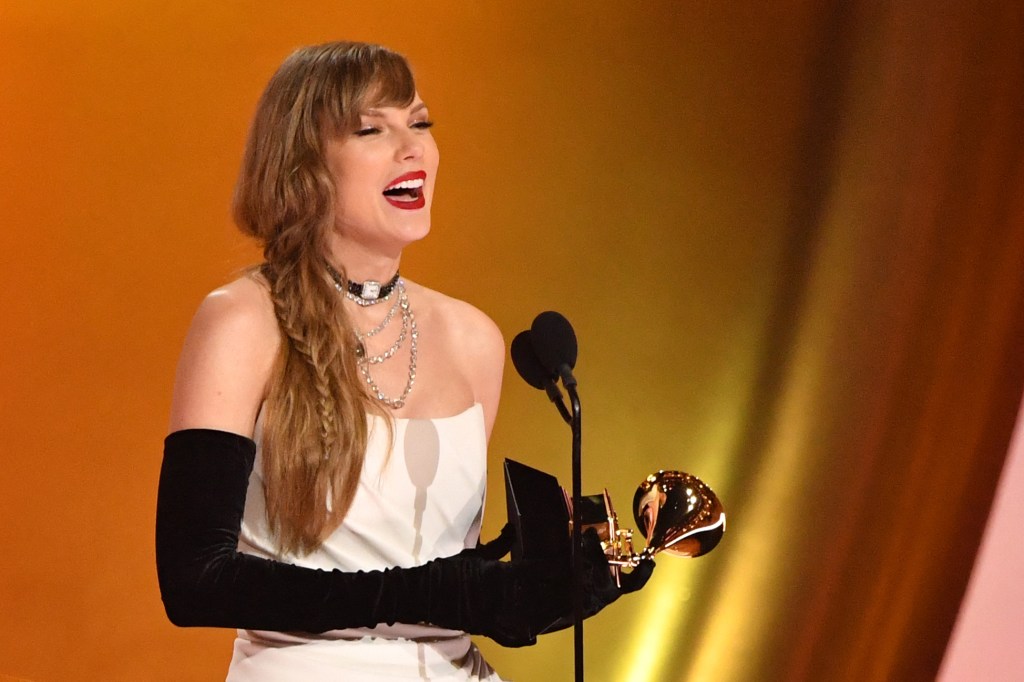 TOPSHOT - US singer-songwriter Taylor Swift accepts the Best Pop Vocal Album award for "Midnights" on stage during the 66th Annual Grammy Awards at the Crypto.com Arena in Los Angeles on February 4, 2024. (Photo by Valerie Macon / AFP) (Photo by VALERIE MACON/AFP via Getty Images)
