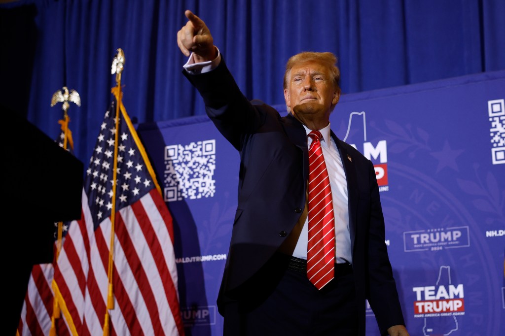 Republican presidential candidate and former President Donald Trump acknowledges supporters at the end of a campaign rally at the Grappone Convention Center on January 19, 2024 in Concord, New Hampshire.