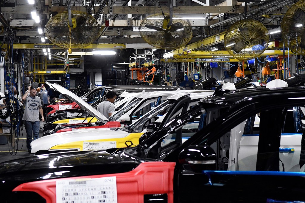 Workers assemble Ford trucks at the Ford Kentucky Truck Plant in Louisville, Kentucky.