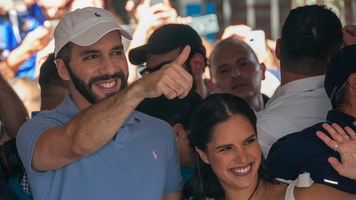 Bukele and wife wave to voters