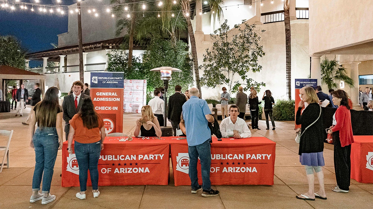 People attending Republican Party of Arizona tables.