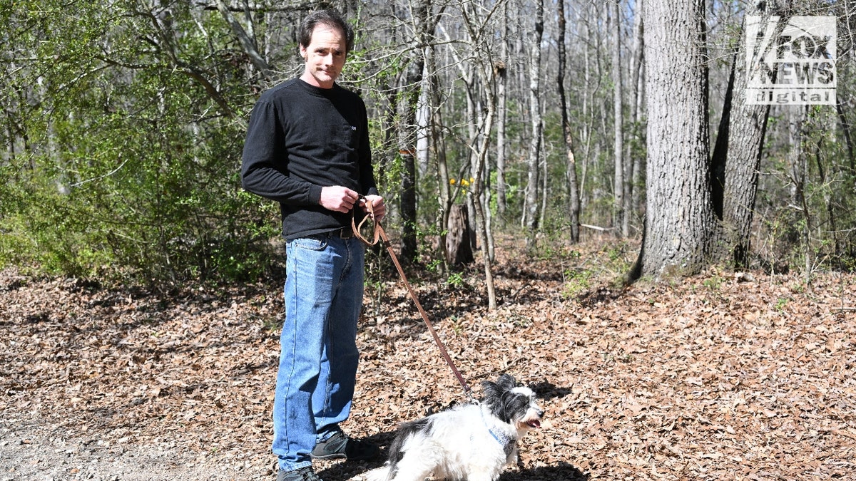 An Athens local walks his dog around a Lake Herrick pedestrian loop