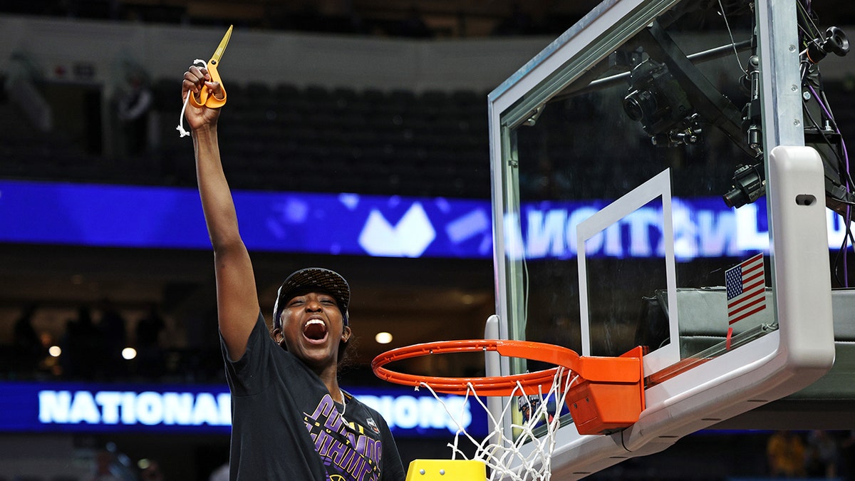 Flau'Jae Johnson cuts down net