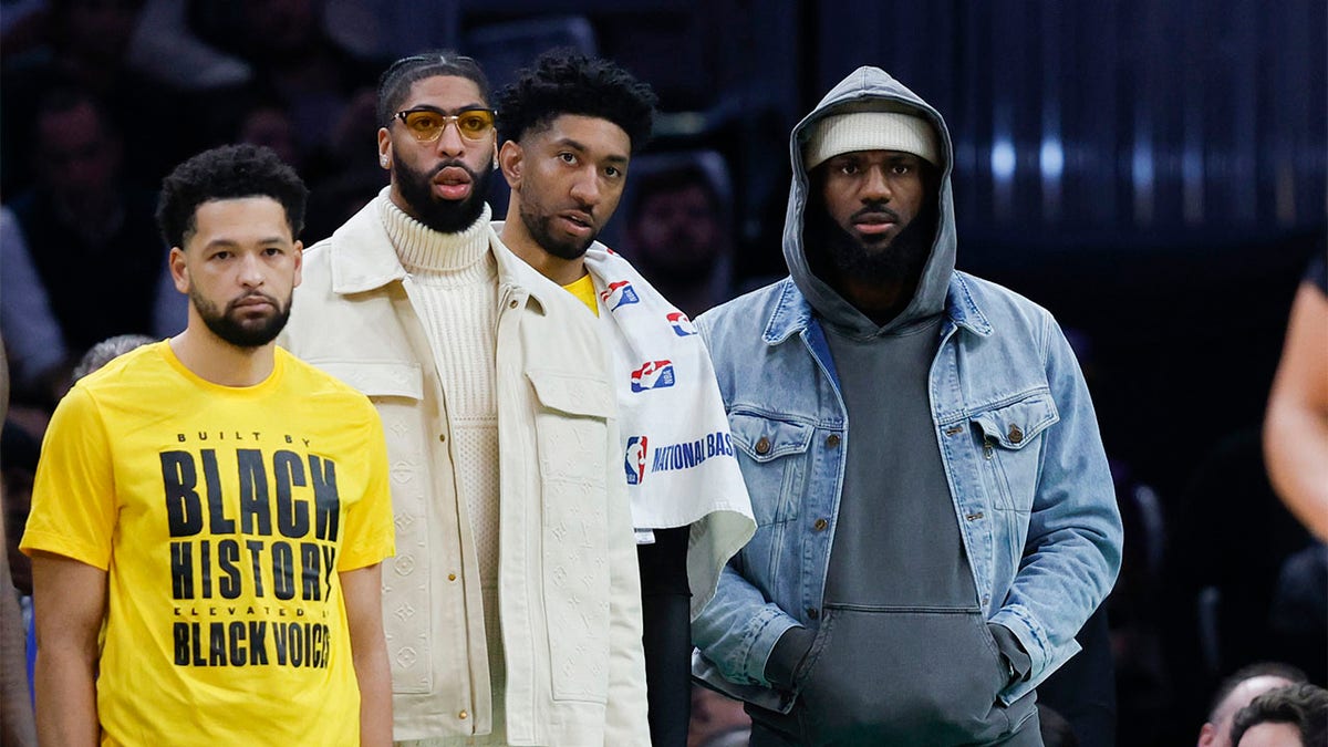 LeBron James watches from the bench